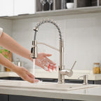 Harbour faucet in a kitchen, hand-wave sensor in use